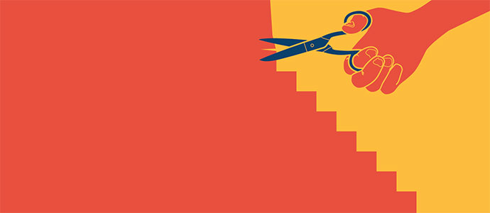 A hand uses scissors to cut out the next step in their career path.